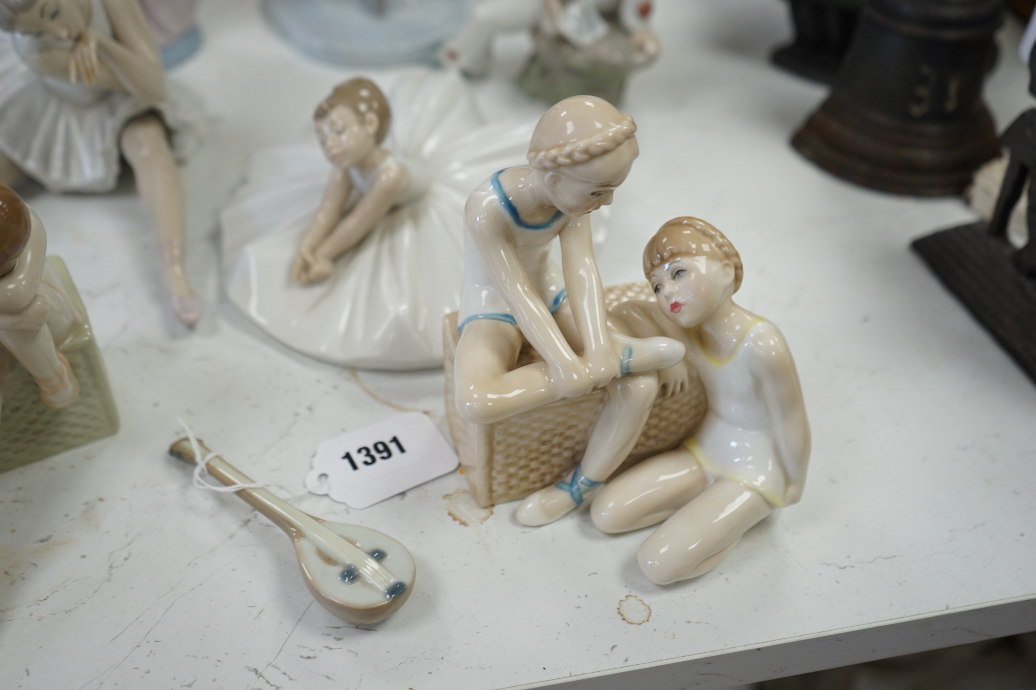 Seven various ceramic figures including Lladro, Nao and Doulton, tallest 33cm